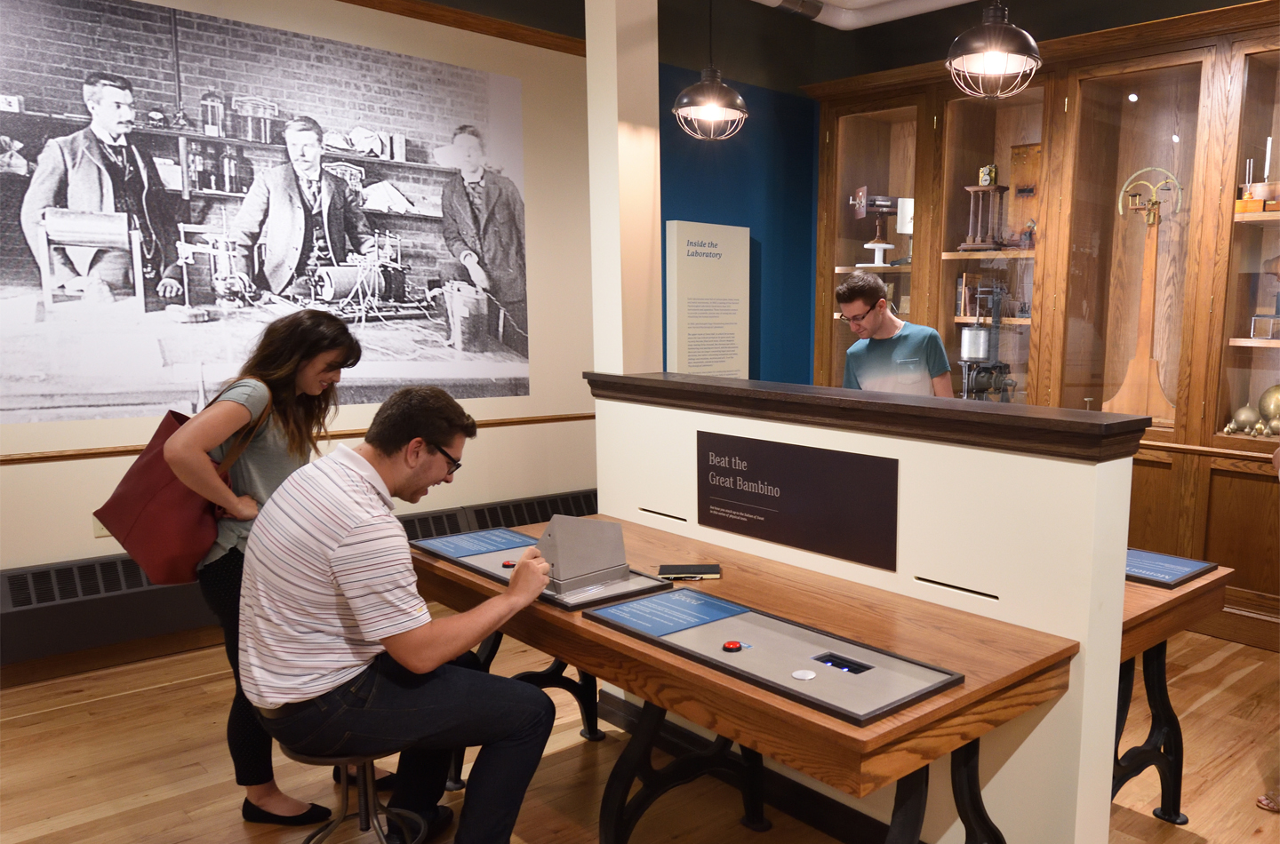 Patrons interacting with exhibits in the Cummings Center for the History of Psychology